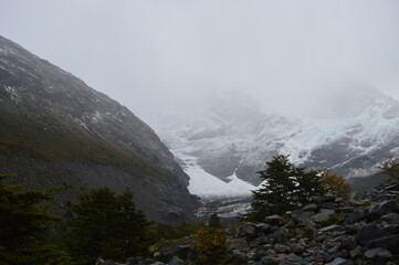 Hiking in the windy and snowy mountains of the Torres del Paine National Park in Patagonia, Chile