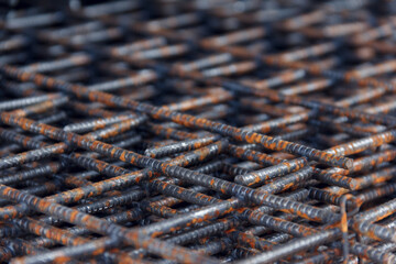 Steel mesh for construction Steel Rebars for reinforced concrete. Steel reinforcement bar texture in construction site.