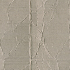 Close up of a light brown vintage rough sheet of carton. Cardboard paper texture with a blank background. Empty papercraft surface. Recycled environmentally friendly material.