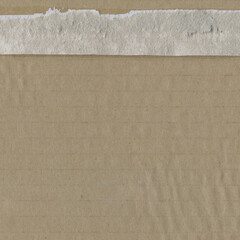 Fototapeta premium Close up of a light brown vintage rough sheet of carton. Cardboard paper texture with a blank background. Empty papercraft surface. Recycled environmentally friendly material.