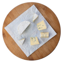 Camembert cheese with white mold on a round board isolated on a white background. Top view.