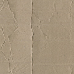 Close up of a light brown vintage rough sheet of carton. Cardboard paper texture with a blank background. Empty papercraft surface. Recycled environmentally friendly material.