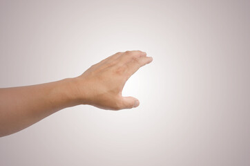 a hand holding something like a bottle or smartphone on white backgrounds, isolated