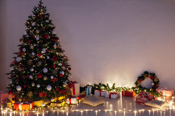 Christmas tree pine with gifts lights garland night New Year's