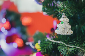 Decorated Christmas baubles on fir tree New Year holidays background