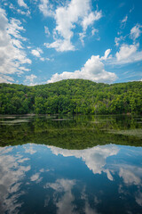 Fototapeta na wymiar Reflections at Brooks Lake, near Bear Mountain in the Hudson Valley, New York
