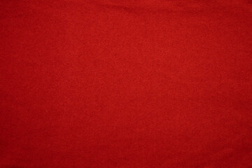 Background texture of red knitted fabric made of cashmere or wool.