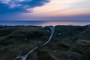 Dunes and Ocean at romantic sundown