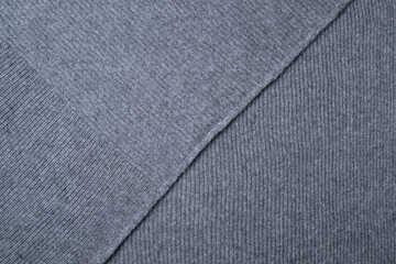 Gray ribbed knitted wool fabric for background.