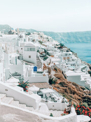 Houses in the mountains overlooking the sea and volcan in oia santorini greece