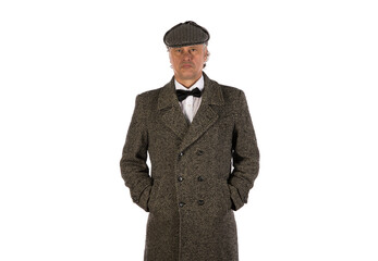 Obraz na płótnie Canvas studio portrait of male businessman in gray coat and hat