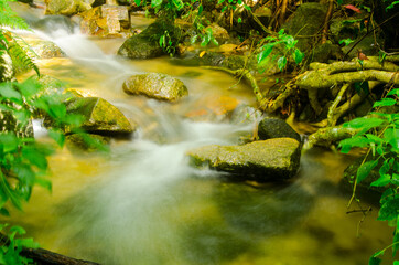 Small waterfall and stone with water motion.