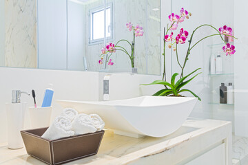 Beautiful Bathroom With  Orchid Flowers in New Luxury Home
