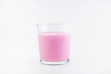 Pink milk drink milk or yogurt, cocktail in a glass glass on a white background. Milk protein shake. Copy space