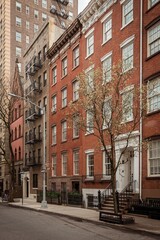 Fototapeta na wymiar Residential buildings on Waverly Place, in the West Village, Manhattan, New York City