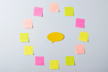 Sticky notes in shape of a circle with yellow cloud in the middle. Empty space for inscription