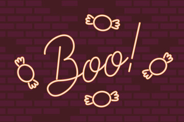 boo word halloween lettering in neon light with candies