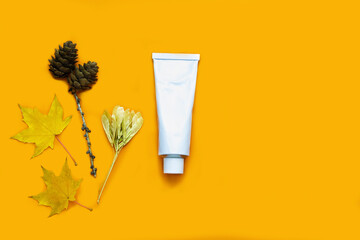 Organic autumn face or body cream on orange background with copy space. Skin care. skin food