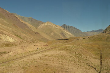 Fototapeta na wymiar Driving through the windy mountain roads of the high Andes between Chile and Argentina