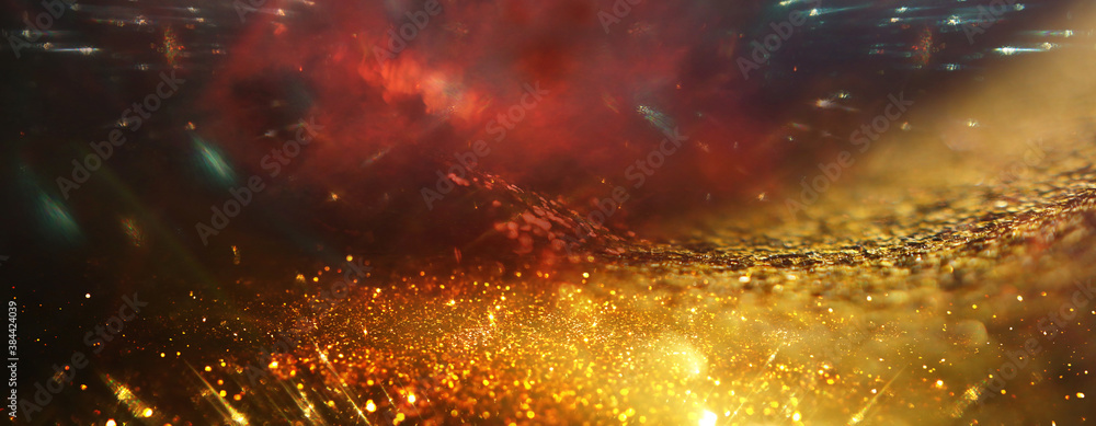 Wall mural background of abstract gold and black glitter lights. defocused