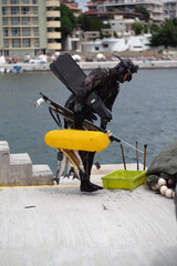Freshly fish caught one by one from underwater diver on the sea shore