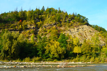 mountain river between sheer cliffs . blue clear water of the river.