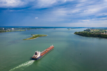 Aerial view of a container ship going downstream in the St. Lawrence River near the port of...