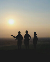 Fototapeta na wymiar silhouettes of people on sunset