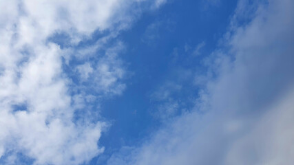 Obraz premium Image of the blue sky in autumn with clouds.