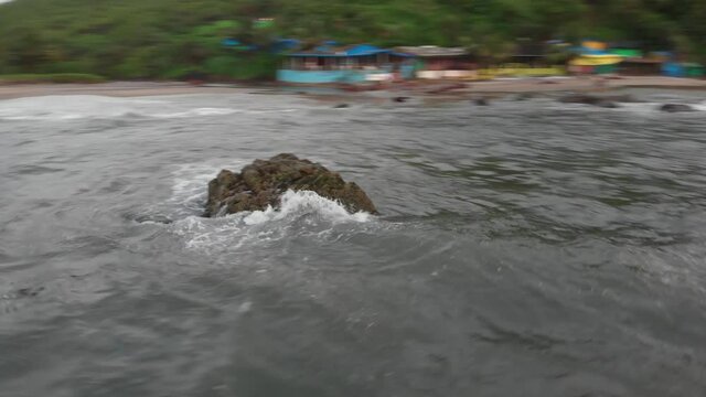 Circumnavigate a Cliff Rock in the Arabian Sea