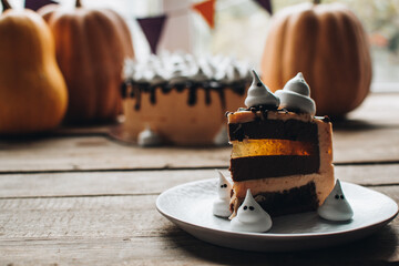 Sweets for halloween party on a wooden table. Halloween style party, candy bar and decorations with...