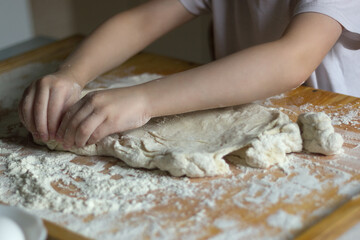 Little boy helping to cook in the kitchen. close-up shot. horizontal