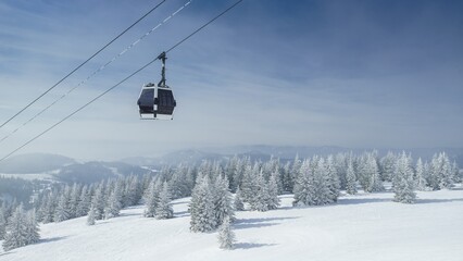 Cabin lift in a ski and snowboard paradise above the winter slope © losonsky