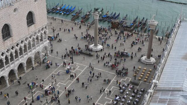 Crowd of people on saint marks square as seen from the bell tower, panorama of venice