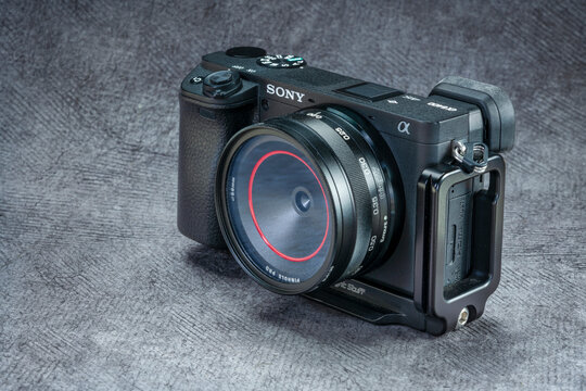 Sony A6400 mirrorless camera with Thingyfy turret pinhole lens covered by UV filter to protect sensor from dust - combining modern technology with old photography technique.
