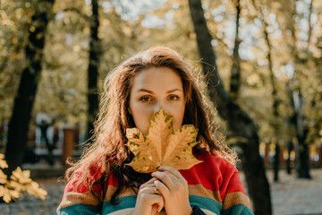 Body Shaming, Low self-worth concept. Sad plus size woman walking in autumn park