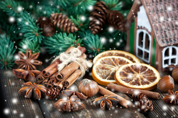 Christmas composition with spices on wooden background