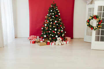 Fototapeta na wymiar Christmas tree pine decor red background New Year holiday gifts