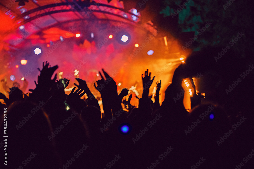 Wall mural abstract blur atmosphere: happy people enjoying outdoor music festival concert, raised up hands and 