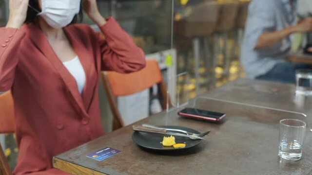 Caucasian customer place credit card to EDC device at cafe restaurant.