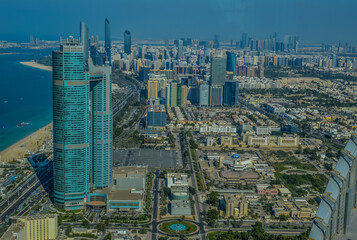Naklejka na ściany i meble Bird's eye and aerial drone view of Abu Dhabi city from observation deck