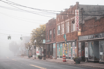 Buildings on Main Street with morning fog, in Ellenville, New York