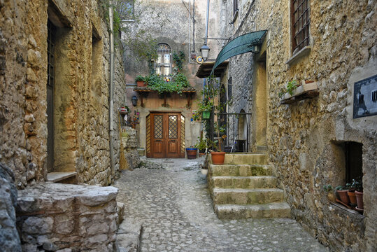 A narrow street between the old houses of Fumone, a medieval village in the province of Frosinone, Italy.