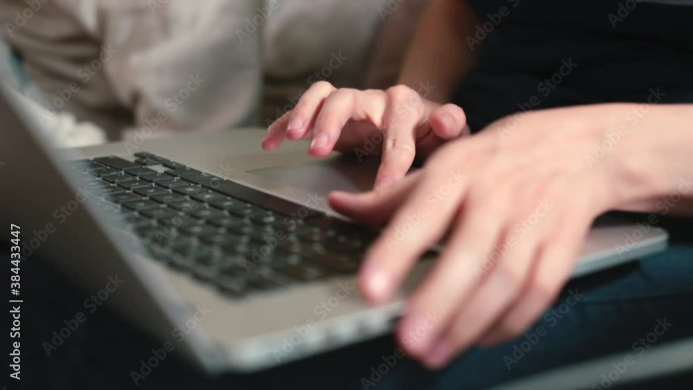 Fototapete working with a computer keyboard. fingers typing a text file. long distance communication using the 