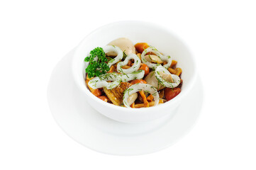 Glass bowl with marinated mushrooms isolated on white background