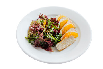 Fresh healthy salad with orange, grilled meat and lettuce.