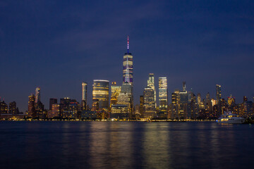 Fototapeta na wymiar New York Skyline after sunset at night summer Manhattan NYC, world trade center, view from Jersey City