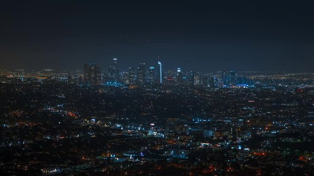 Timelapse of Los Angeles skyline at night. Big city in the USA. Skyscrapers and street lights with traffic