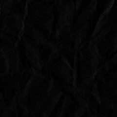 Black vintage and old looking crumpled paper background. Retro cardboard texture. Grunge paper for drawing. Ancient book page. Present wrapping.