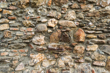 Old stone wall surface with cement. Vintage wall, background, texture.